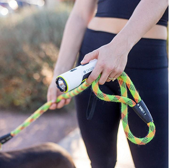 Woman holding TASER Strikelight 2